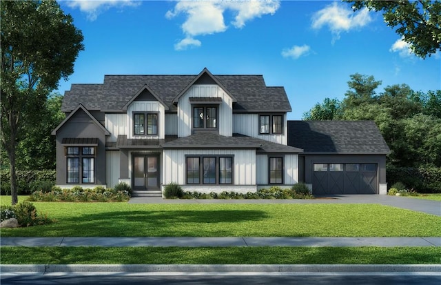 view of front of house featuring a garage and a front yard