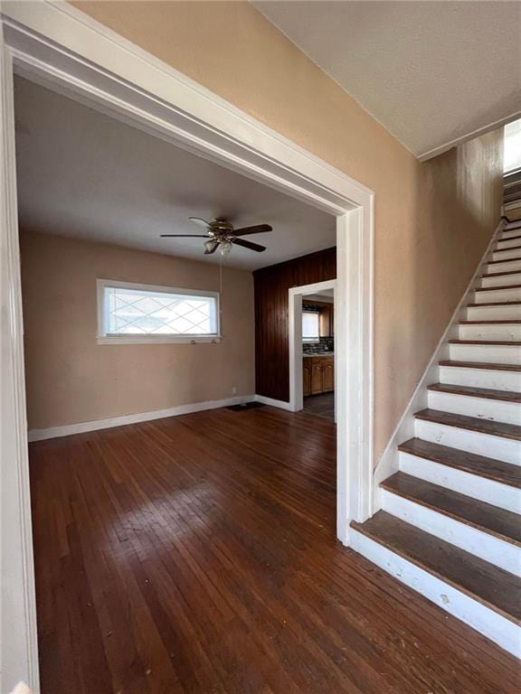 interior space with dark hardwood / wood-style floors and ceiling fan