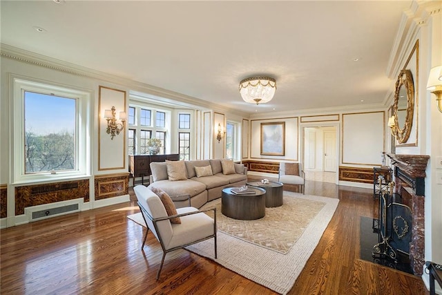 living room with ornamental molding and dark hardwood / wood-style floors