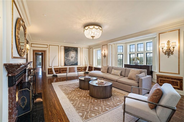 living room featuring ornamental molding, an inviting chandelier, and dark hardwood / wood-style flooring