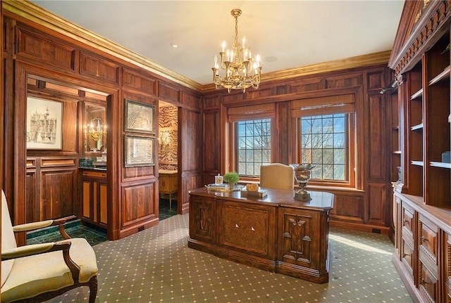 office area featuring carpet floors, crown molding, wood walls, and a chandelier