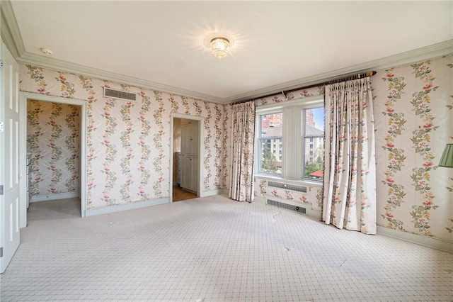 unfurnished bedroom featuring carpet floors and crown molding