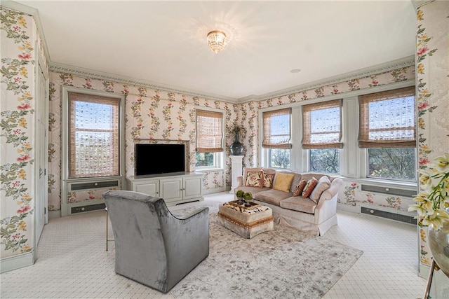 living room with ornamental molding and light colored carpet