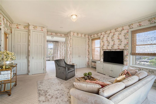 living room featuring ornamental molding and a healthy amount of sunlight