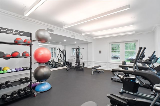 gym featuring crown molding