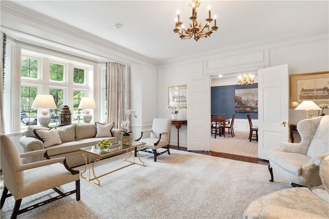 living room featuring ornamental molding, hardwood / wood-style flooring, and a chandelier