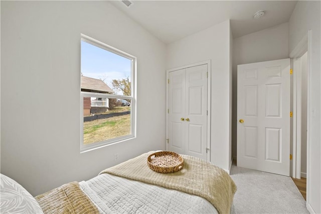 bedroom featuring light carpet