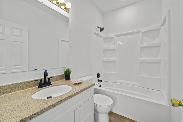 full bathroom featuring hardwood / wood-style flooring, vanity, shower / bath combination, and toilet