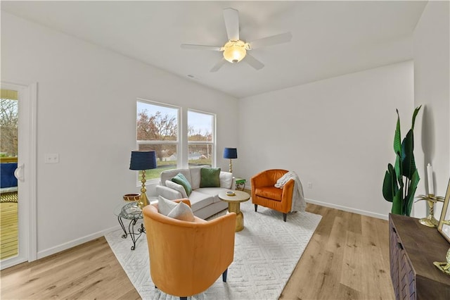 sitting room featuring a wealth of natural light, light hardwood / wood-style flooring, and ceiling fan