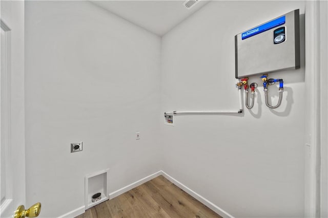 laundry area with hardwood / wood-style floors, electric dryer hookup, and hookup for a washing machine