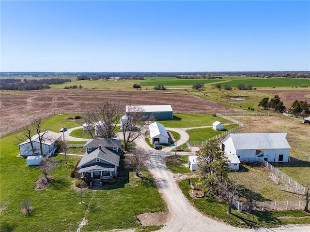 birds eye view of property with a rural view