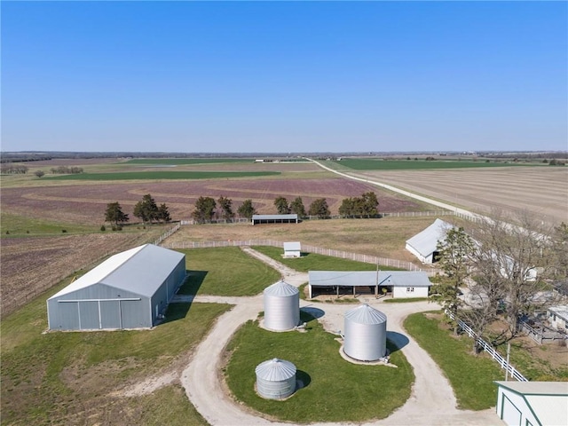 birds eye view of property with a rural view