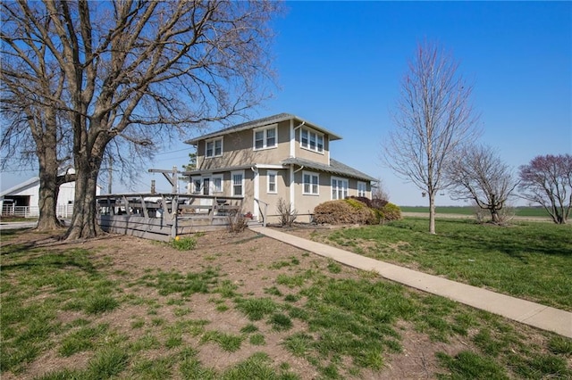 view of front of home with a front yard