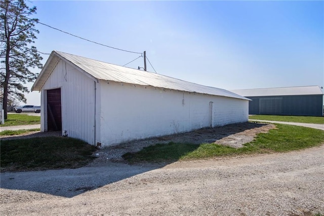 exterior space featuring an outdoor structure and a garage