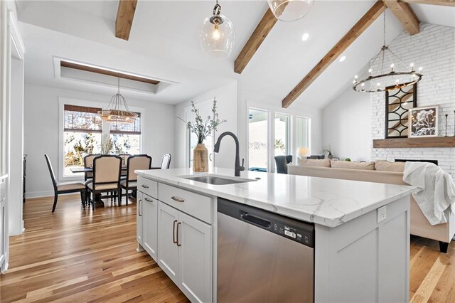 20287 Barker St, Spring Hill, KS 66083 - kitchen with dishwasher, a chandelier, light stone counters, light wood-style flooring, and recessed lighting