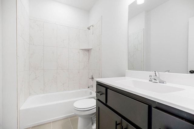 full bathroom featuring tile patterned floors, vanity, tiled shower / bath combo, and toilet