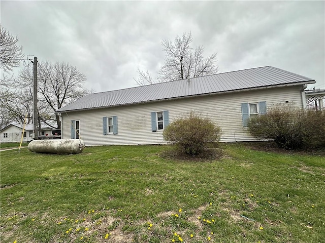 rear view of house with a lawn