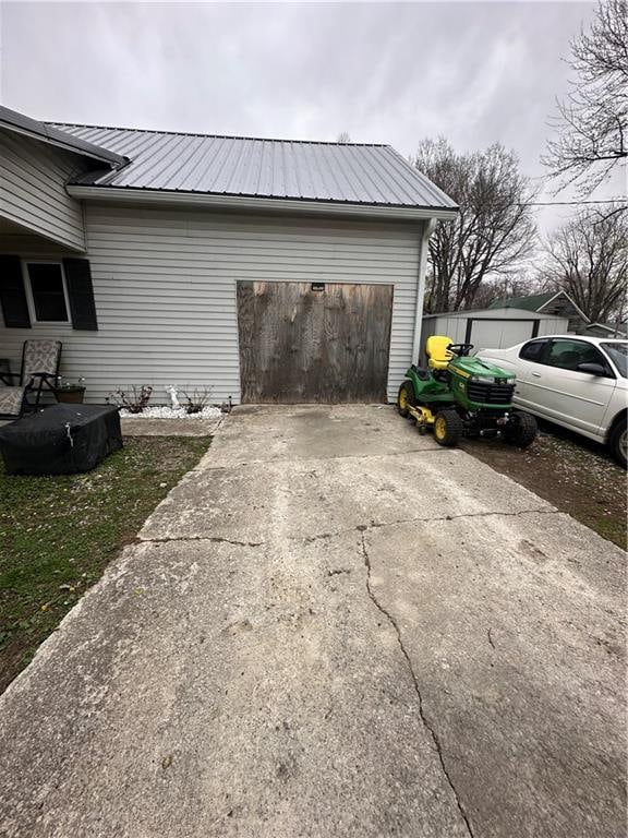 view of side of property with a garage