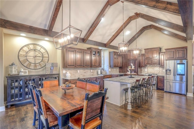 dining room with dark wood-type flooring, a chandelier, high vaulted ceiling, and beamed ceiling