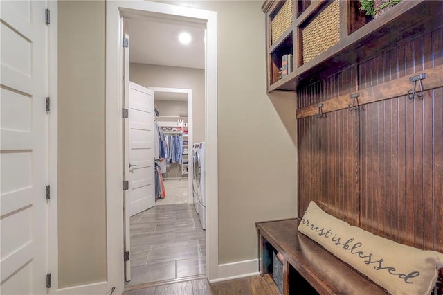 mudroom featuring dark wood-type flooring and washer and dryer