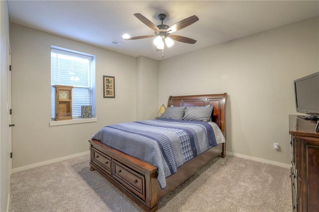 bedroom with light carpet and ceiling fan