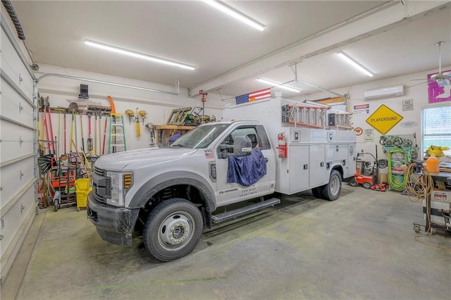 garage featuring an AC wall unit