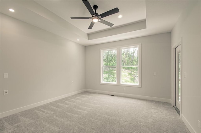 16615 NW 124th St, Platte City, MO 64079 - empty room featuring light colored carpet, recessed lighting, ceiling fan, and a raised ceiling
