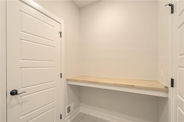 16615 NW 124th St, Platte City, MO 64079 - mudroom with built in desk and light tile patterned floors