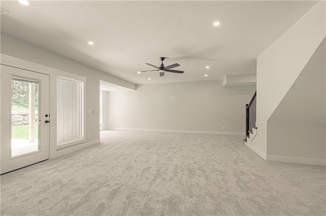 16615 NW 124th St, Platte City, MO 64079 - unfurnished living room with recessed lighting, light carpet, stairs, and a ceiling fan