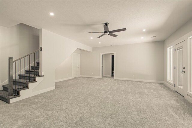 16615 NW 124th St, Platte City, MO 64079 - unfurnished living room with carpet flooring, a ceiling fan, recessed lighting, stairway, and a textured ceiling