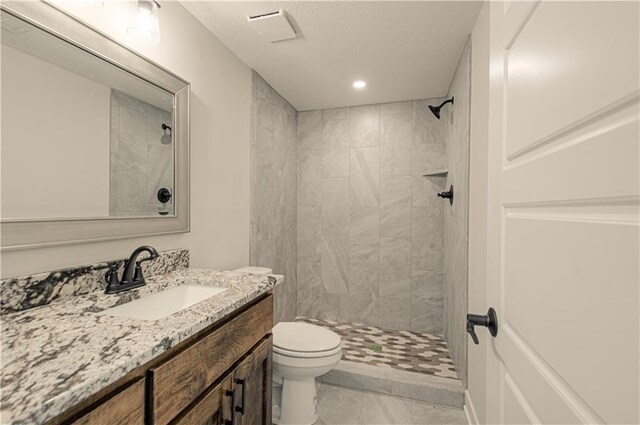 16615 NW 124th St, Platte City, MO 64079 - full bathroom featuring vanity, tiled shower, a textured ceiling, and recessed lighting