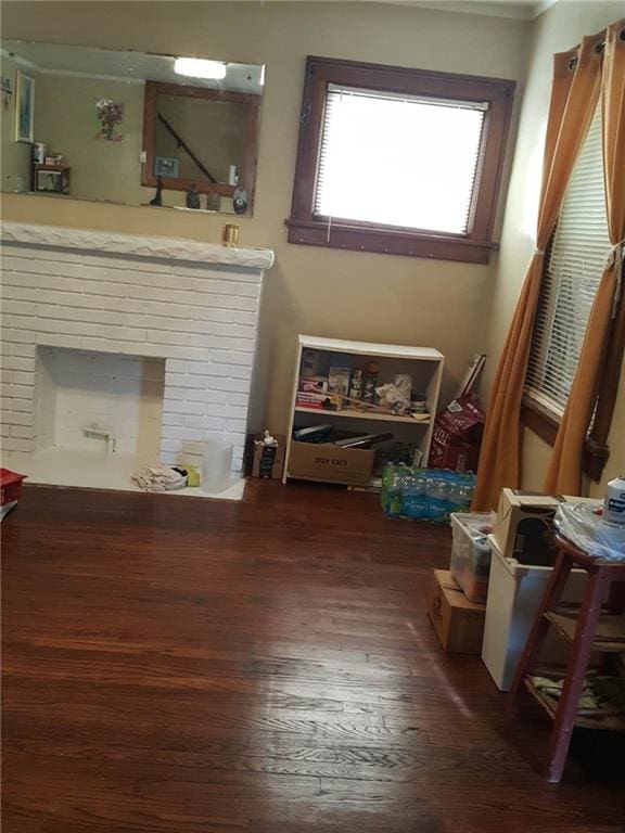 living room featuring dark hardwood / wood-style floors and a fireplace