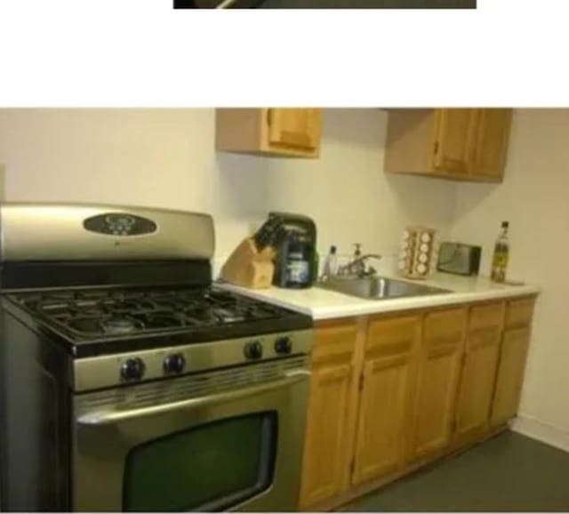 kitchen with sink and stainless steel gas range oven