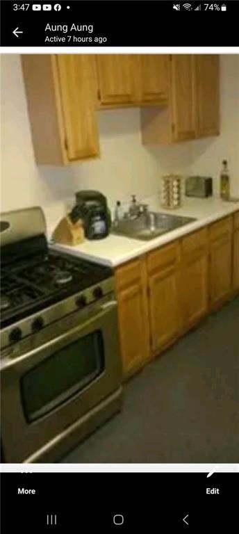 kitchen with range with two ovens and sink