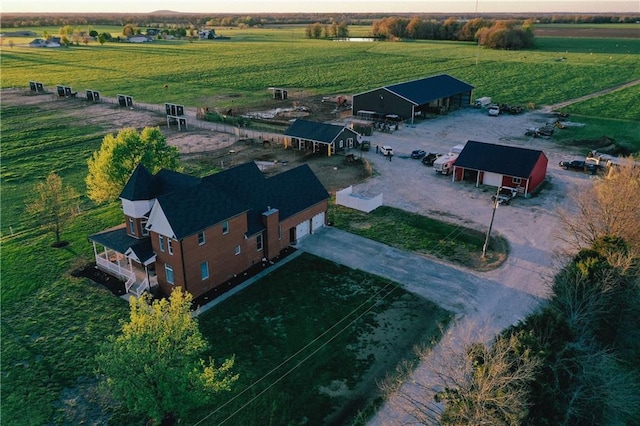 birds eye view of property with a rural view