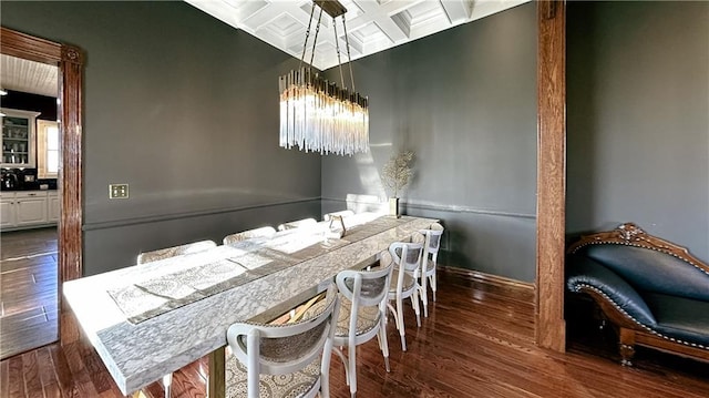 dining area with plenty of natural light and dark hardwood / wood-style floors