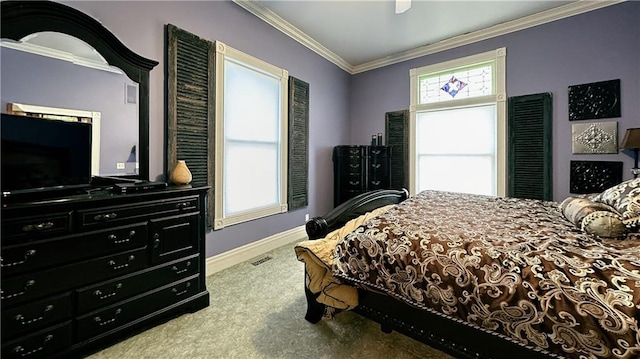 bedroom with multiple windows, carpet floors, ornamental molding, and ceiling fan