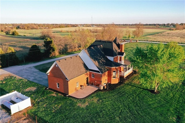 birds eye view of property featuring a rural view