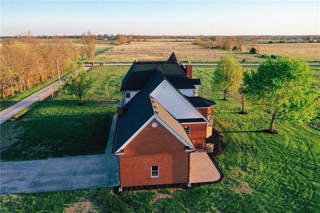 birds eye view of property featuring a rural view