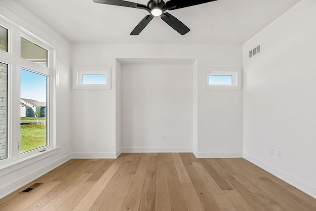 unfurnished room with ceiling fan and light hardwood / wood-style floors