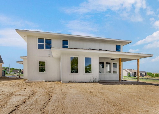 rear view of house featuring ceiling fan