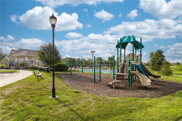 view of play area featuring a lawn