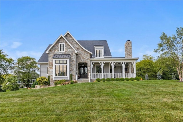 view of front of house with a porch and a front yard