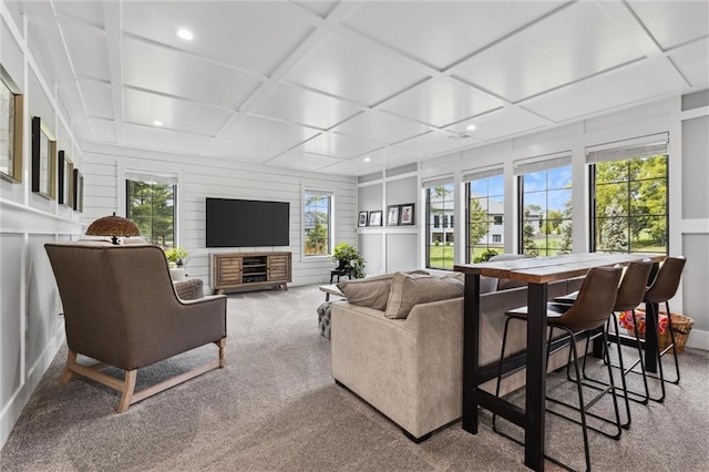 living room with coffered ceiling and carpet flooring