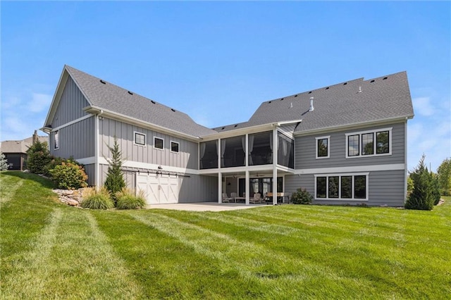 back of property featuring a sunroom, a yard, and a patio area