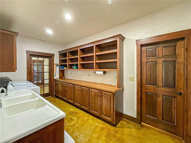 kitchen with carpet and separate washer and dryer