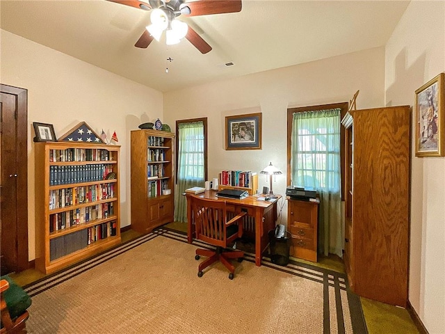 office with ceiling fan and carpet