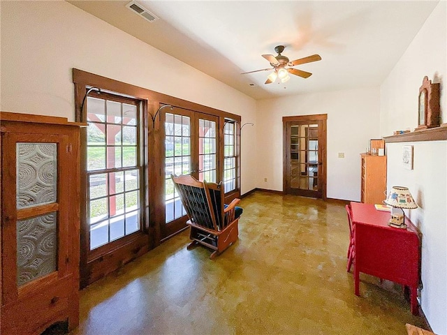 carpeted entryway featuring ceiling fan and french doors