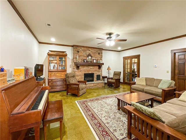 living room with ceiling fan, a stone fireplace, ornamental molding, and french doors