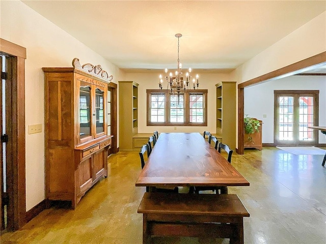 dining area with an inviting chandelier